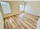 This bedroom features wood-look floors and natural light from two windows at 3919 Lilac Haze St, Las Vegas, NV 89147