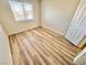 Bright, clean bedroom with new vinyl floors and a closet at 3919 Lilac Haze St, Las Vegas, NV 89147