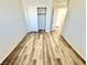 Bright bedroom with wood-look floors, closet, and natural light at 3919 Lilac Haze St, Las Vegas, NV 89147