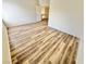 Bright bedroom featuring laminate flooring and a door to the second floor landing at 3919 Lilac Haze St, Las Vegas, NV 89147