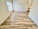 Bright bedroom with laminate flooring and a window offering natural light at 3919 Lilac Haze St, Las Vegas, NV 89147