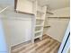 A walk-in closet with built-in shelves and plenty of storage space at 3919 Lilac Haze St, Las Vegas, NV 89147