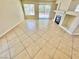 Bright living room featuring tile flooring, a fireplace, and a sliding glass door at 3919 Lilac Haze St, Las Vegas, NV 89147