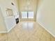 Bright living room featuring tile flooring, a fireplace, and large windows for natural light at 3919 Lilac Haze St, Las Vegas, NV 89147