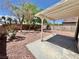 Outdoor patio with ample space for seating, perfect for entertaining with a rock landscape at 3919 Lilac Haze St, Las Vegas, NV 89147