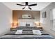 Main bedroom featuring a decorative ceiling fan, and a cozy bed with striped linens at 4200 S Valley View Blvd # 2085, Las Vegas, NV 89103