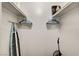 Walk-in closet with rod for hanging clothes, ironing board and vacuum cleaner at 4200 S Valley View Blvd # 2085, Las Vegas, NV 89103