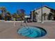 Community hot tub with lounge chairs for tenants and nearby high rise at 4200 S Valley View Blvd # 2085, Las Vegas, NV 89103