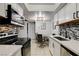 Updated kitchen with stainless steel appliances and a cozy dining area at 4200 S Valley View Blvd # 2085, Las Vegas, NV 89103