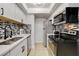 Modern kitchen with stainless steel appliances, white cabinets, and stylish backsplash at 4200 S Valley View Blvd # 2085, Las Vegas, NV 89103