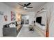 Inviting living room features a comfortable leather sofa, modern decor, and a sliding glass door to a private balcony at 4200 S Valley View Blvd # 2085, Las Vegas, NV 89103