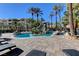 Stunning community pool area with lounge chairs and tropical landscaping at 4200 S Valley View Blvd # 2085, Las Vegas, NV 89103