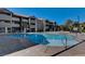 Community pool with tanning deck and nearby building for tenants at 4200 S Valley View Blvd # 2085, Las Vegas, NV 89103