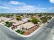 An aerial view of the home in a neighborhood with mature trees shows nearby properties and quiet streets at 4537 Colonial Canyon St, North Las Vegas, NV 89031