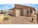 Backyard featuring a partially-shaded patio and landscaping at 4537 Colonial Canyon St, North Las Vegas, NV 89031
