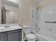 This bathroom includes a shower-tub combo with grab bars, providing safety and accessibility in a stylish design at 4537 Colonial Canyon St, North Las Vegas, NV 89031