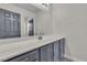 Bathroom vanity with a large mirror, modern sink and fixtures at 4537 Colonial Canyon St, North Las Vegas, NV 89031