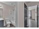 Inviting bathroom featuring a shower-tub combination with grab bars, providing safety and style at 4537 Colonial Canyon St, North Las Vegas, NV 89031