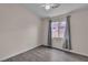 Bedroom featuring laminate floors, a sunlit window, and neutral wall paint, creating a cozy space at 4537 Colonial Canyon St, North Las Vegas, NV 89031