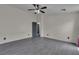 Spacious bedroom featuring gray wood-look flooring and a modern ceiling fan with integrated lighting at 4537 Colonial Canyon St, North Las Vegas, NV 89031