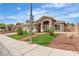 Charming single-story home featuring an arched entryway and manicured front lawn at 4537 Colonial Canyon St, North Las Vegas, NV 89031