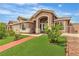 Well-maintained home with vibrant green lawn, complemented by mature landscaping at 4537 Colonial Canyon St, North Las Vegas, NV 89031