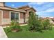 Close up of home featuring large windows, complemented by the manicured front lawn at 4537 Colonial Canyon St, North Las Vegas, NV 89031