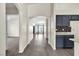 Inviting hallway showcases an arched entryway, leading to the living area and kitchen at 4537 Colonial Canyon St, North Las Vegas, NV 89031