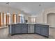 Kitchen island featuring a stainless steel sink and view of living area and fireplace at 4537 Colonial Canyon St, North Las Vegas, NV 89031
