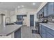 Kitchen view showcasing blue cabinets, a modern backsplash, and stainless steel appliances at 4537 Colonial Canyon St, North Las Vegas, NV 89031