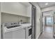 Convenient laundry area features a GE washer and dryer, ensuring ease and efficiency in your daily chores at 4537 Colonial Canyon St, North Las Vegas, NV 89031