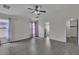 Large living room with laminate flooring, ceiling fan, and lots of natural light, an ideal entertaining space at 4537 Colonial Canyon St, North Las Vegas, NV 89031
