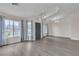 Open-concept living area with hardwood floors, chandelier, and multiple windows at 4537 Colonial Canyon St, North Las Vegas, NV 89031