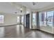 Spacious living area boasting multiple windows, a high ceiling, and modern floors at 4537 Colonial Canyon St, North Las Vegas, NV 89031