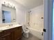 Bright bathroom featuring a vanity, toilet, and a shower-tub combination at 4651 Wild Oak Way, North Las Vegas, NV 89031