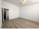 Spacious bedroom featuring light wood floors and a ceiling fan with ample natural light at 4651 Wild Oak Way, North Las Vegas, NV 89031