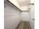 Walk-in closet with wood floors and shelving and hanging space at 4651 Wild Oak Way, North Las Vegas, NV 89031