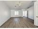 An open floor plan with new floors, a ceiling fan, and a large window at 4651 Wild Oak Way, North Las Vegas, NV 89031