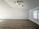 A spacious living room featuring modern flooring and large window at 4651 Wild Oak Way, North Las Vegas, NV 89031