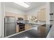 Kitchen features stainless steel appliances, granite countertops, and ample cabinet space at 5250 S Rainbow Blvd # 2070, Las Vegas, NV 89118