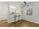 Bright open living area featuring kitchen bar seating and ceiling fan for comfortable living at 5250 S Rainbow Blvd # 2070, Las Vegas, NV 89118