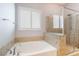 Bright bathroom with soaking tub and separate glass shower at 5384 Candlespice Way, Las Vegas, NV 89135