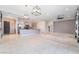 Spacious open-concept living area seamlessly connects the living room and kitchen, ideal for entertaining at 5384 Candlespice Way, Las Vegas, NV 89135