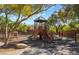 Neighborhood playground with slides, climbing structure, and shade cover provides a fun and safe recreational area at 5384 Candlespice Way, Las Vegas, NV 89135