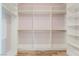 Spacious walk-in closet features custom shelving and ample hanging space for organization and storage at 5384 Candlespice Way, Las Vegas, NV 89135