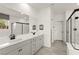 Bright bathroom features dual sinks, large mirror, and a separate shower at 5530 Hill Spire St, Las Vegas, NV 89166