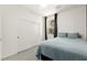 Comfortable bedroom with sliding closet doors, and a large window at 5530 Hill Spire St, Las Vegas, NV 89166