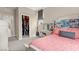 Bedroom with bright décor, a view of the community, and walk-in closet access at 5530 Hill Spire St, Las Vegas, NV 89166