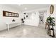 Inviting entryway with light tile flooring, white walls, and an attractive decorative shelf at 5530 Hill Spire St, Las Vegas, NV 89166