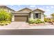 Charming single-story home featuring a two-car garage and well-maintained landscaping at 5530 Hill Spire St, Las Vegas, NV 89166